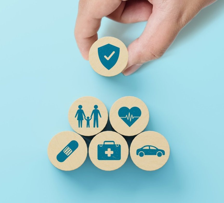 Health care medical insurance life, family, car travel and house concept. Wooden block with icon healthcare on blue background